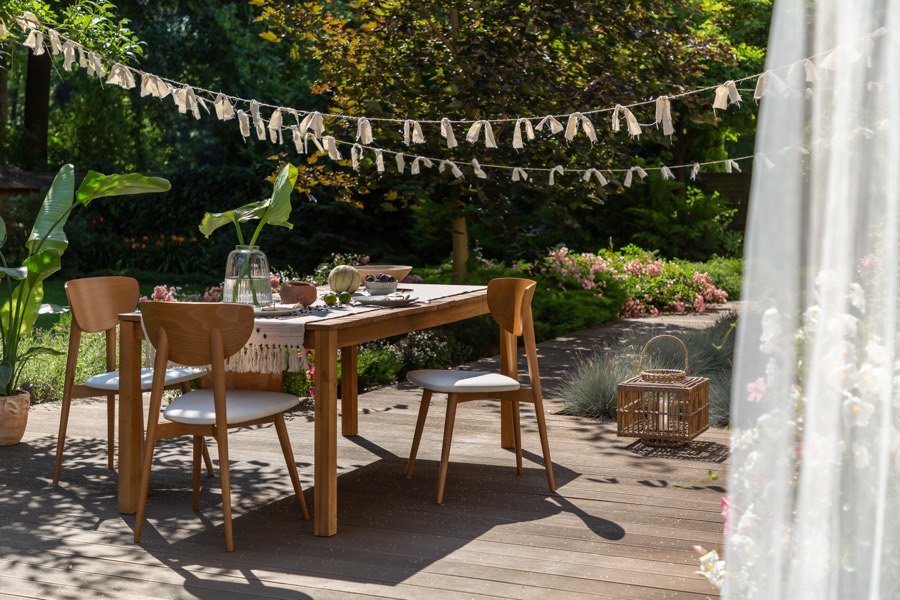 Garden table set with bunting for an outdoor birthday celebration
